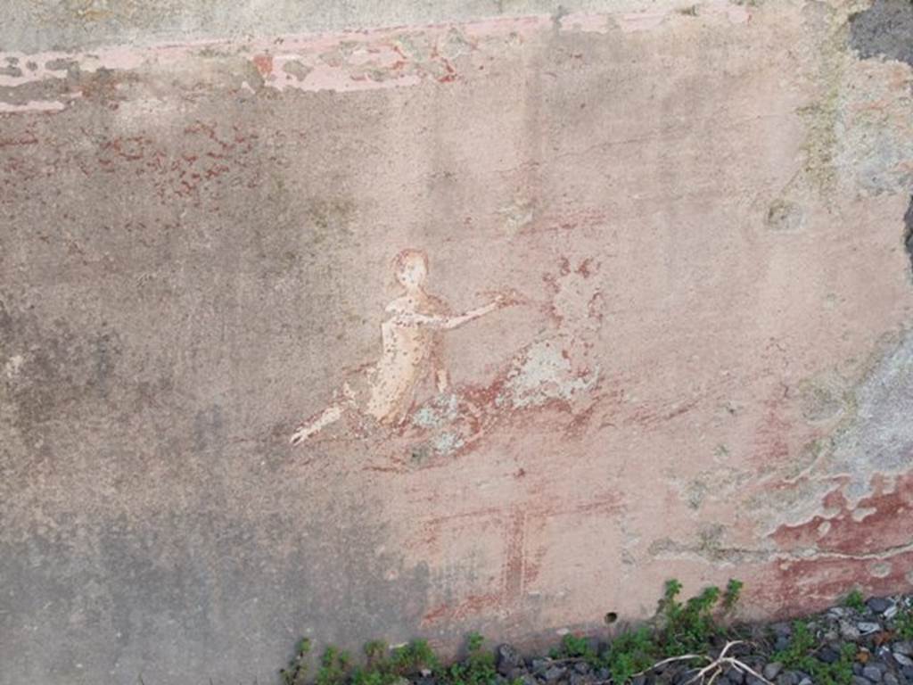 VI.9.2 Pompeii. March 2009. Peristyle 16, west wall in north-west corner showing painting of figure on sea creature. 