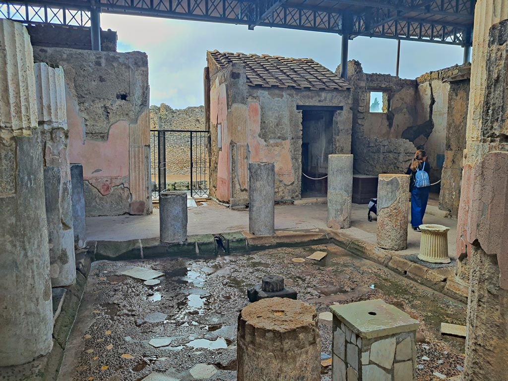 VI.9.6 Pompeii. November 2023. 
Room 3, looking west across impluvium in atrium from outside room 9, tablinum. Photo courtesy of Giuseppe Ciaramella.



