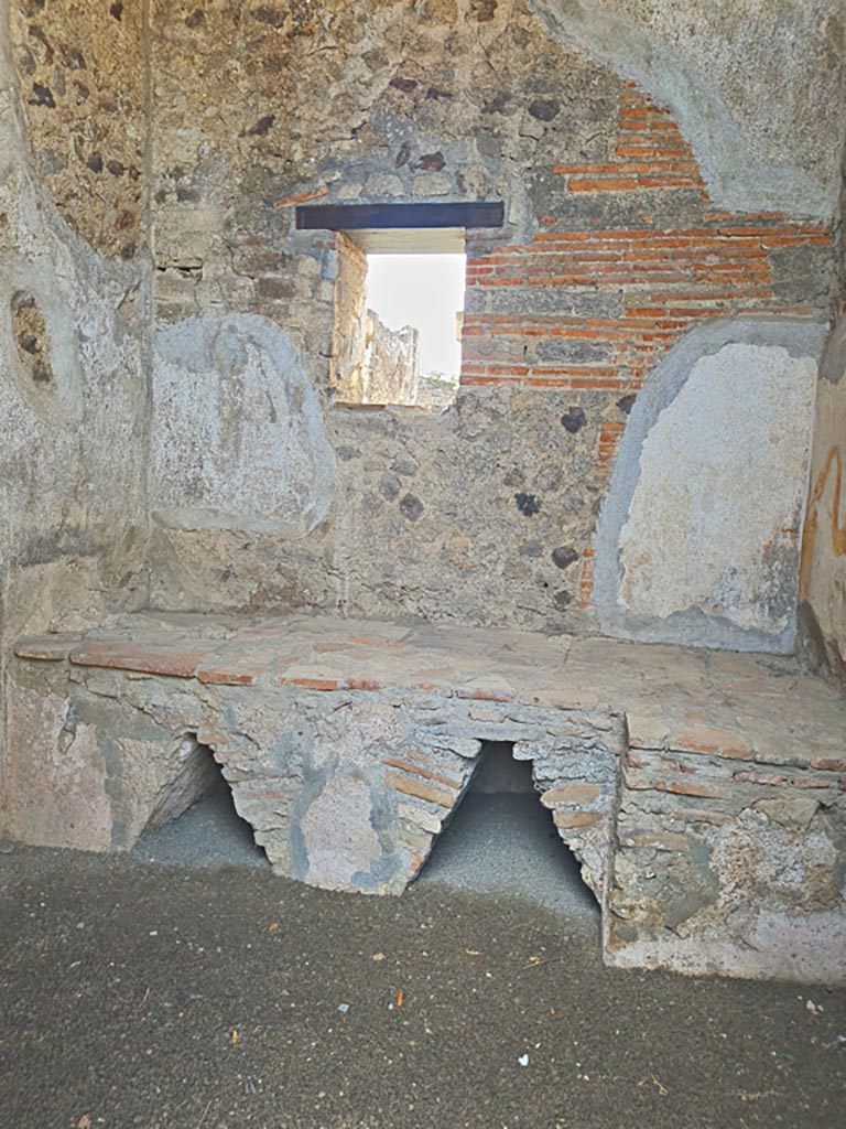 VI.9.7 Pompeii. November 2023. 
Room 4, hearth in kitchen against west wall. Photo courtesy of Giuseppe Ciaramella.
