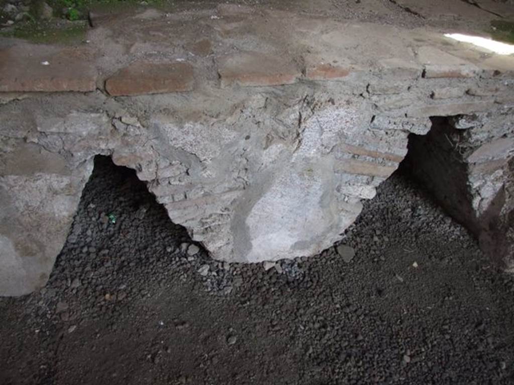 VI.9.7 Pompeii. March 2009. Room 4, triangular shaped fronts of storage area underneath the hearth in the kitchen.