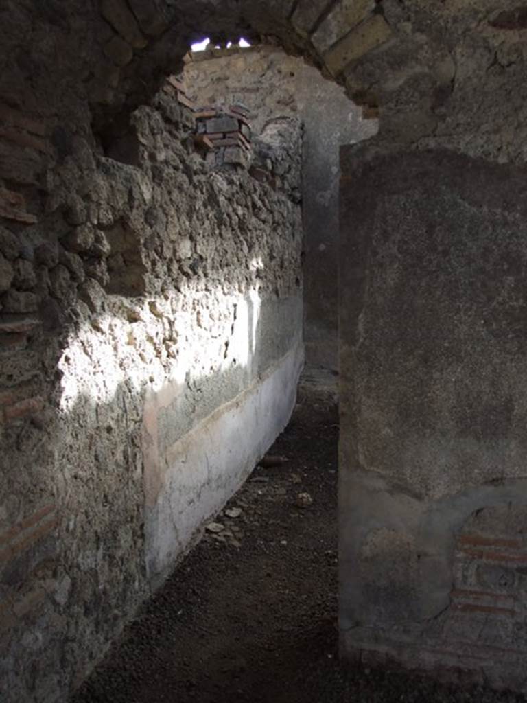 VI.9.7 Pompeii. March 2009. Room 4, arched entrance in south wall of kitchen leading to room 5.
