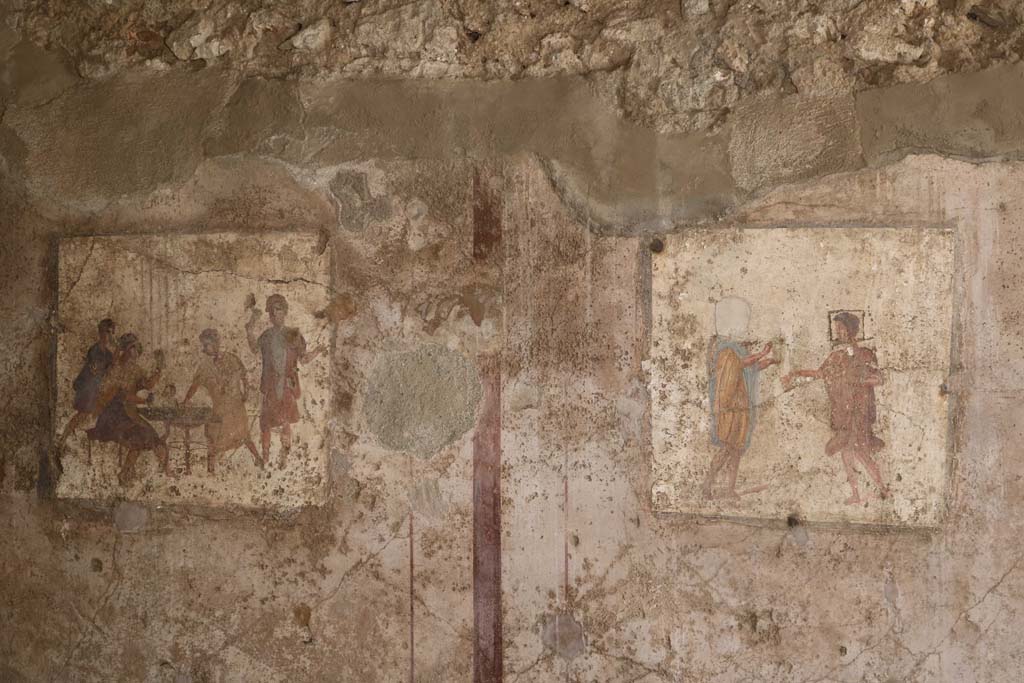 VI.10.1 Pompeii. December 2018. Two frescoes near east end of south wall, of rear room. Photo courtesy of Aude Durand.