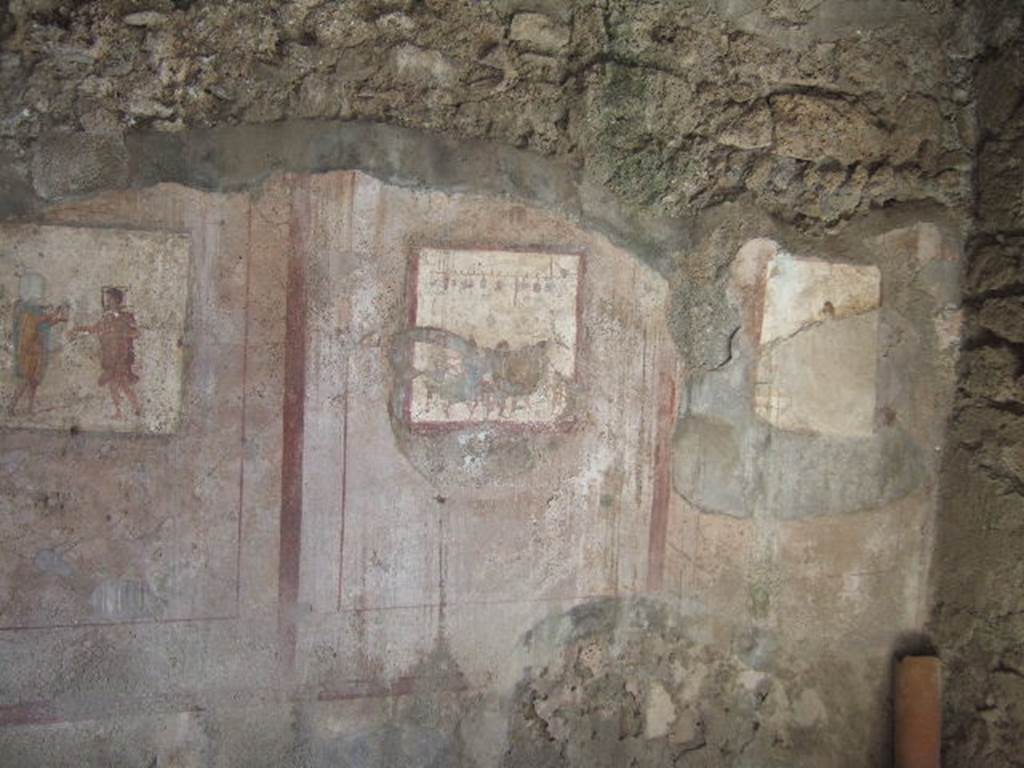 VI.10.1 Pompeii. September 2005. Frescoes on south wall of rear room on north side. According to Garcia y Garcia, the 1943 bombing was the cause of the decay and loss to the paintings on the south wall. See Garcia y Garcia, L., 2006. Danni di guerra a Pompei. Rome: L’Erma di Bretschneider. (p.80)
