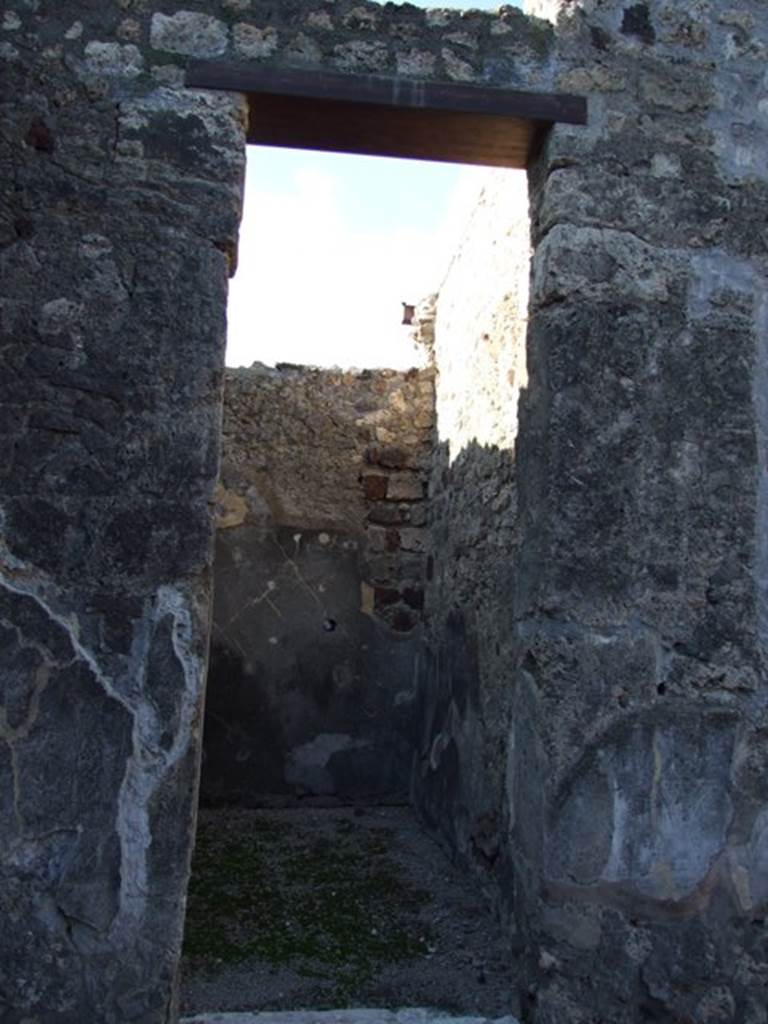 VI.11.10 Pompeii. December 2007. 
Doorway to room 28, looking towards north-west corner and along north wall. 

