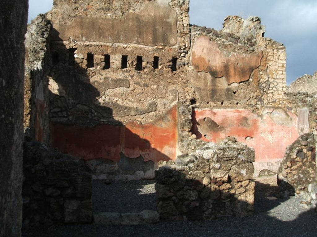 VI.14.8 Pompeii. December 2004. Doorways to two rear rooms. According to Eschebach, on the left was a triclinium, on the right was a small room with stairs to upper floor. See Eschebach, L., 1993. Gebudeverzeichnis und Stadtplan der antiken Stadt Pompeji. Kln: Bhlau. (p.209)
