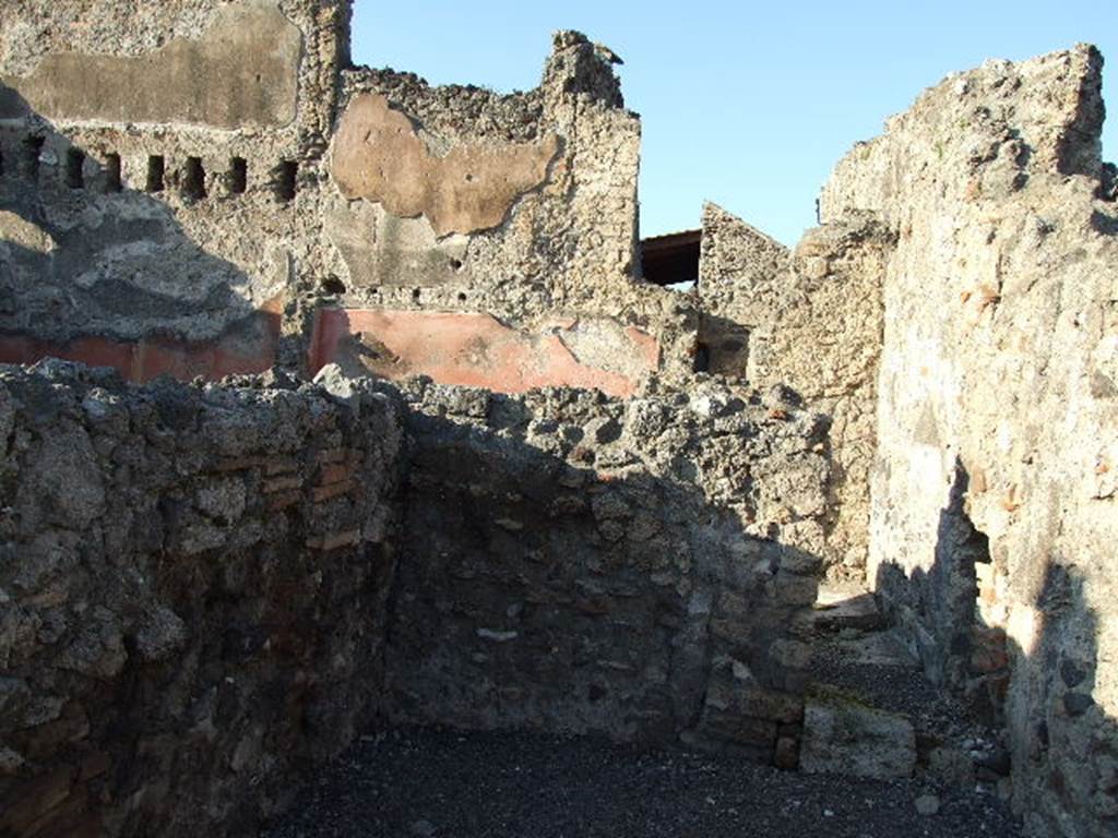 VI.14.9 Pompeii. December 2006. North wall with doorway to light-yard.