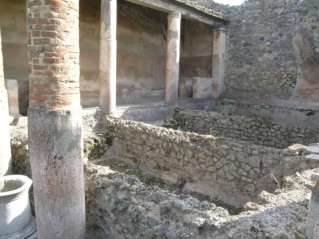 VI.14.22 Pompeii. June 2005. 
Room 12, looking south-west across peristyle converted into a fullonica. Photo courtesy of Nicolas Monteix.
