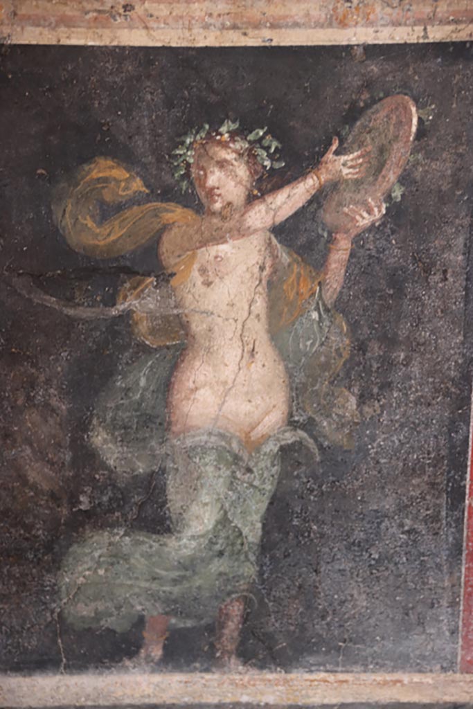 VI.15.1 Pompeii. October 2023. 
Panel in zoccolo towards west end of north wall, with standing female figure of a Bacchante.
Photo courtesy of Klaus Heese.
