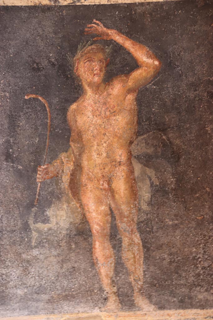VI.15.1 Pompeii. October 2023. 
Zoccolo on east side of central panel, painting of Satyr. Photo courtesy of Klaus Heese.
