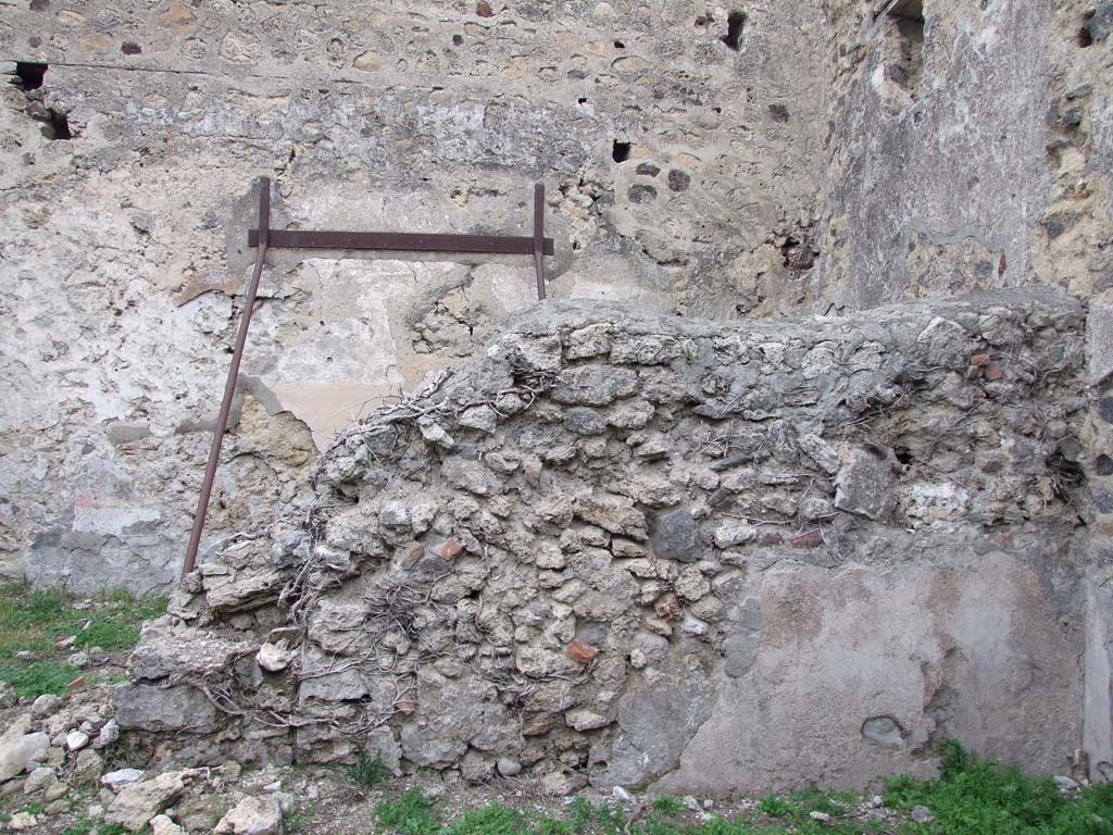 VI.16.2 Pompeii. December 2007. Looking north at rear wall of bar-room.
According to Sogliano, this wall had a doorway leading into the rear room, on the left. The wall also had a window towards the right.
See Notizie degli Scavi di Antichità, 1906, (p.346).
