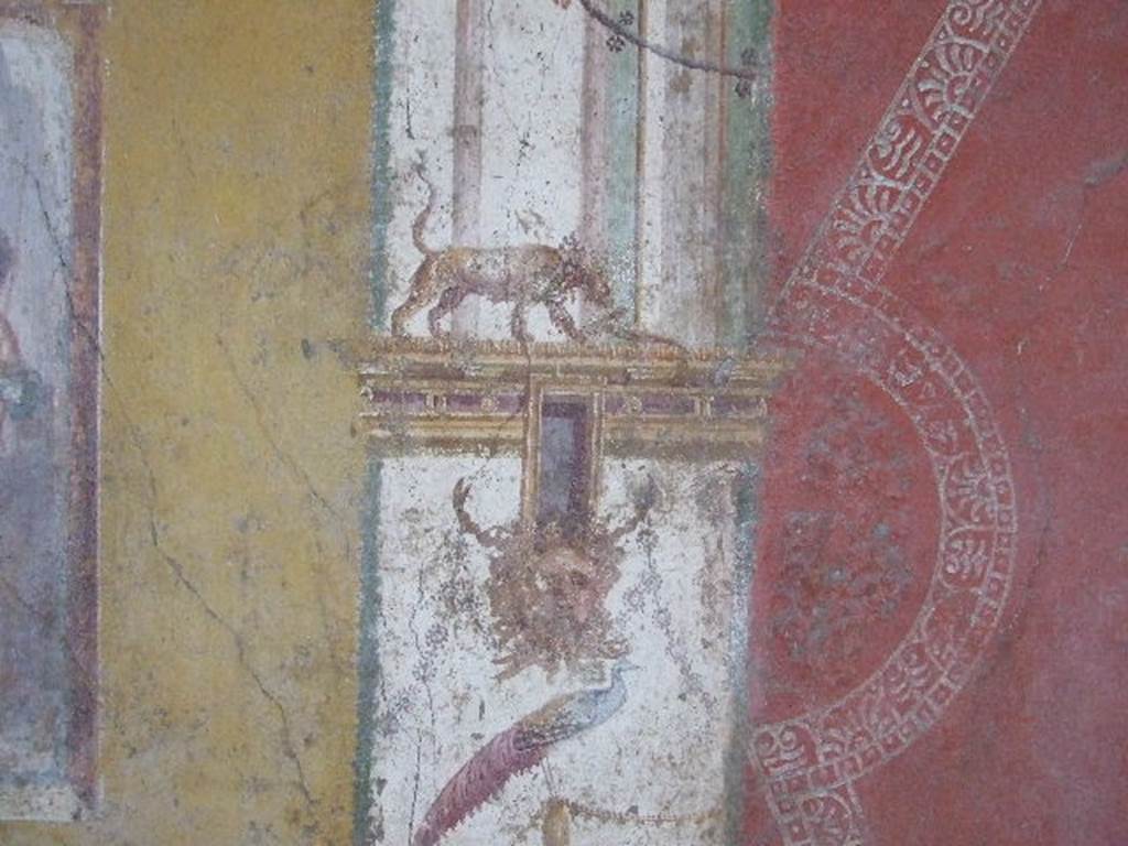 VI.16.15 Pompeii. December 2006. 
North end of central painting of west wall of room F. Detail of architectural wall painting with panther, mask and peacock.

