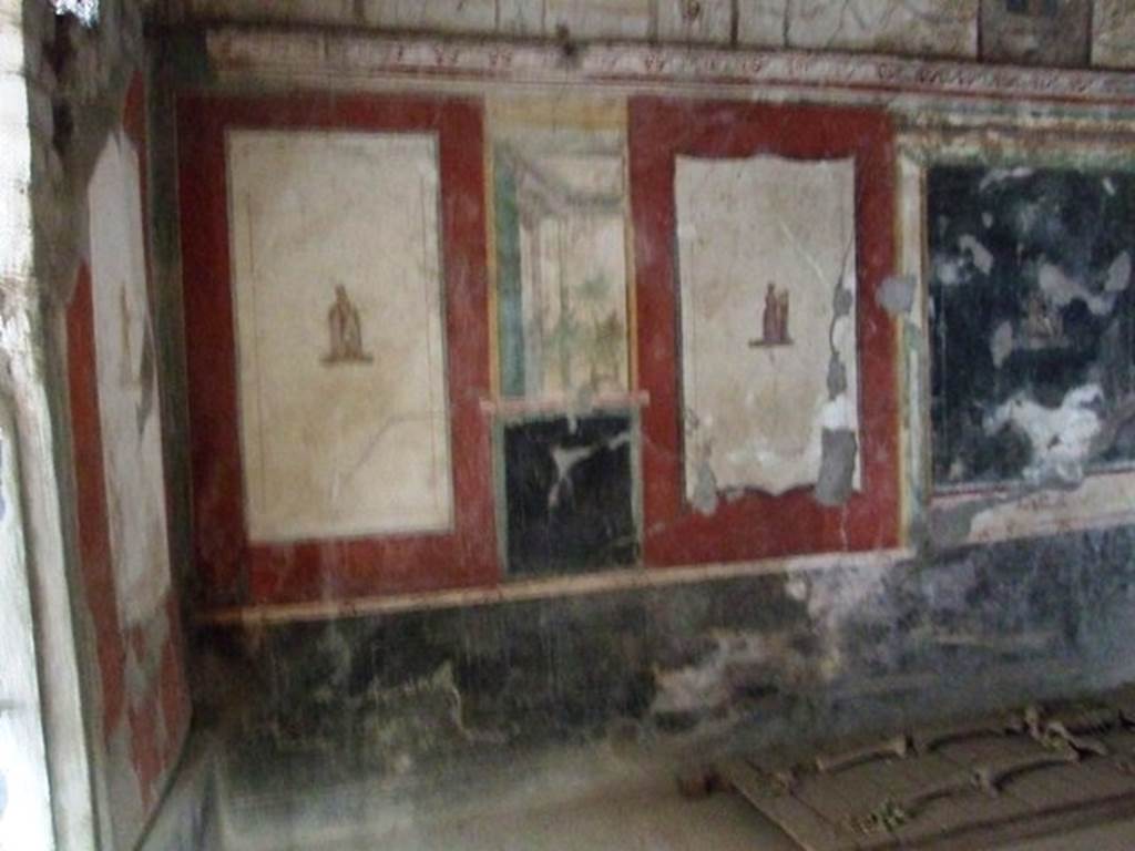 VI.17.42 Pompeii. December 2007. Second triclinium 19. West end of north wall. The panel at the west end (left) has Euterpe, the muse of lyric poetry, with writing materials. On the right is Terpsichore,  the muse of dance and song, with a five string lyre supported  on a small pillar. See Aoyagi M. and Pappalardo U., 2006. Pompei (Regiones VI-VII) Insula Occidentalis. Napoli: Valtrend.  (p. 107).