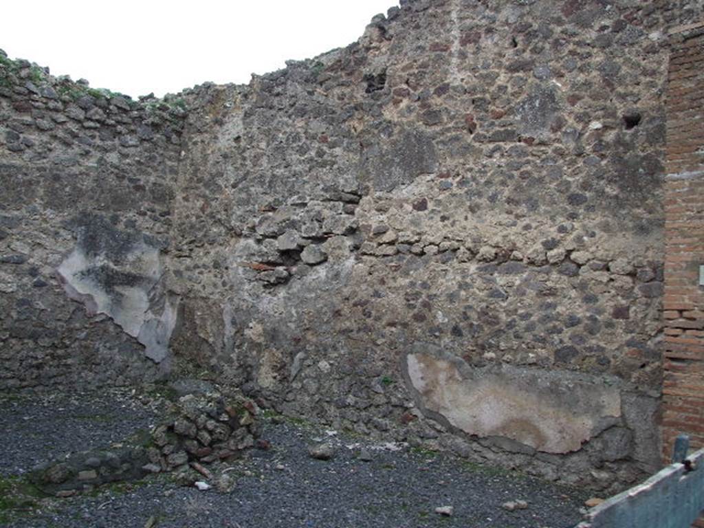VII.1.37 Pompeii. December 2006. South-west corner with remains of walls of cubiculum at rear.