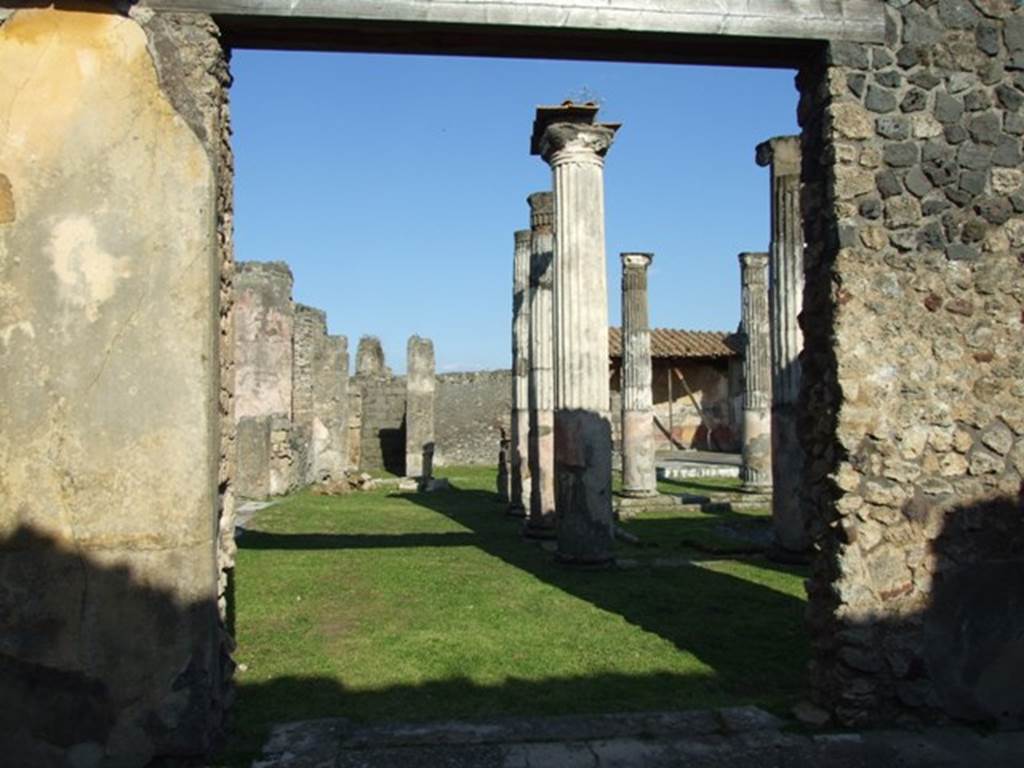 VII.4.31 Pompeii. March 2009. Room 20, doorway in east wall of oecus, looking east across middle peristyle.