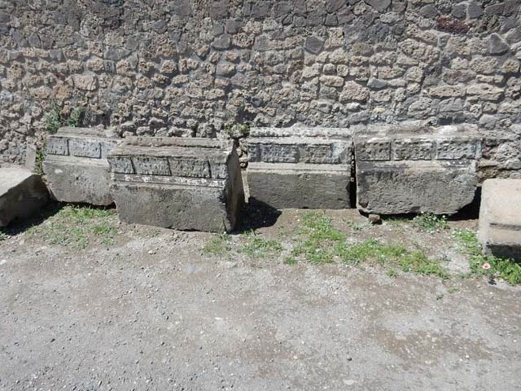 VII.7.32 Pompeii. May 2018. Remains of stones with decoration from the Temple, against the west wall. 
Photo courtesy of Buzz Ferebee.
