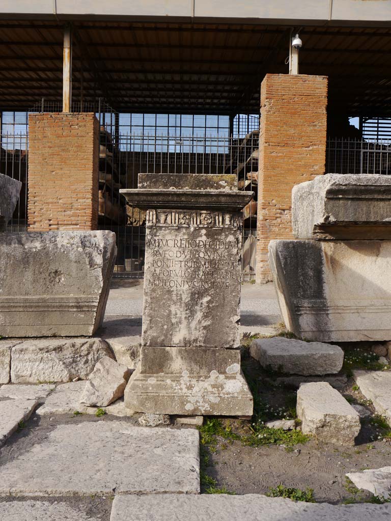 VII.8.00, Pompeii Forum. March 2019. 
Looking west to pedestal base for M. Lucretio Decidian Rufo set up by M. Pilonius Rufus in north-west corner.
Foto Anne Kleineberg, ERC Grant 681269 DÉCOR.
