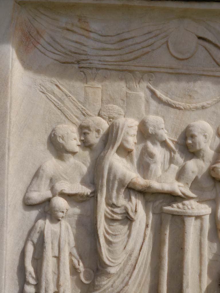 VII.9.2 Pompeii. March 2019. Detail of north end of west side of altar. 
Foto Anne Kleineberg, ERC Grant 681269 DÉCOR.
