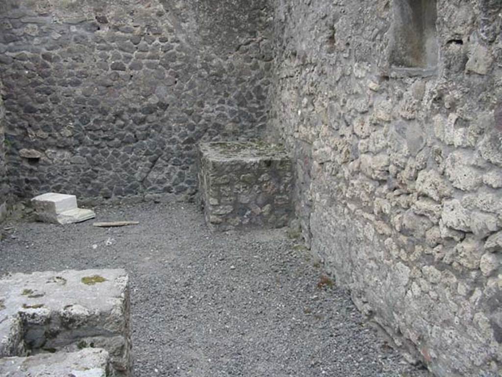 VII.9.22 Pompeii. May 2003. 
Looking towards the south wall and south-west corner from the hearth at the rear of the counter. Photo courtesy of Nicolas Monteix.

