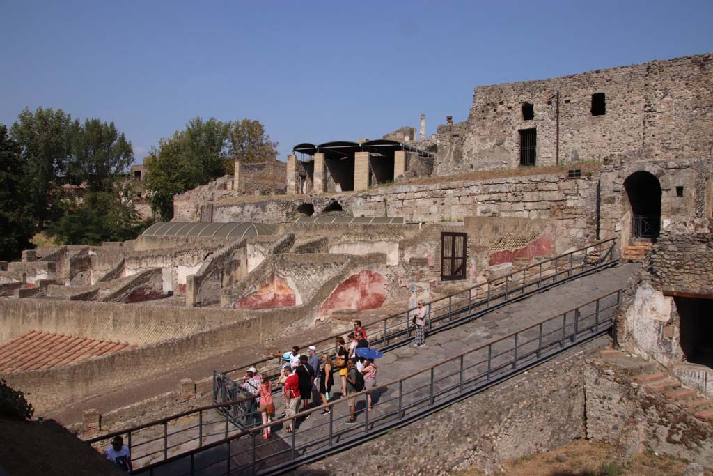 VII.16.a Pompeii. September 2019.  Looking north-east towards doorway to rooms on upper level, (centre right) and Porta Marina (right). 
In the centre, on the skyline, are lower rooms belonging to VII.16.13. Photo courtesy of Klaus Heese.
