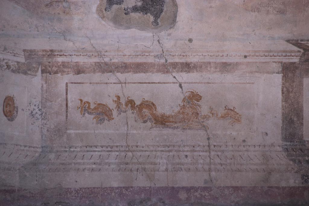 VIII.2.23 Pompeii. October 2022. 
Detail of painted dolphins and sea creature from the zoccolo/dado towards the west end of the south wall. Photo courtesy of Klaus Heese.
