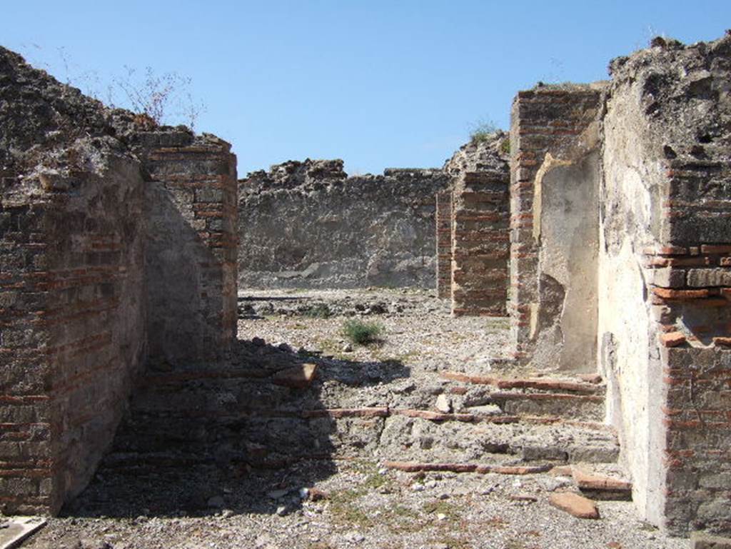 VIII.2.30 Pompeii. September 2005. Looking south-east onto lower level at rear. In the left front would have been the kitchen, in the right front would have been a cubiculum. In the rear would have been two large vaulted rooms with open doorways onto the narrow portico, with a beautiful view.

