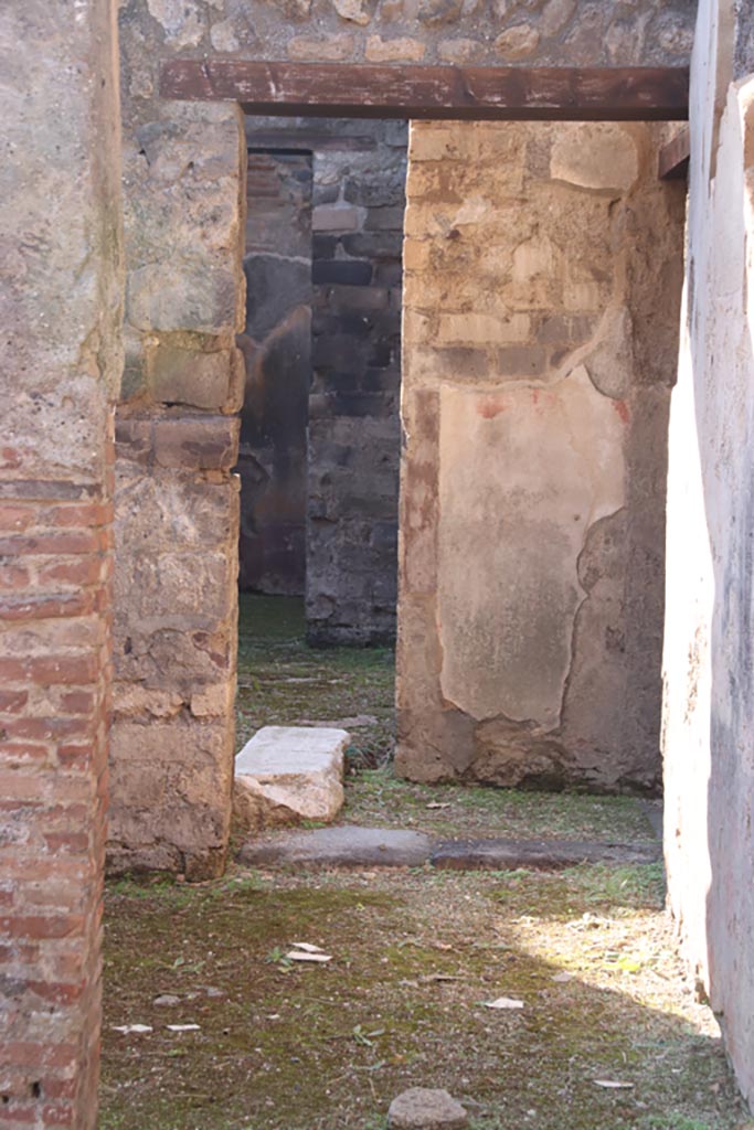 VIII.3.11 Pompeii. May 2006. Doorway in west wall, leading to steps to upper floor at VIII.3.10.
