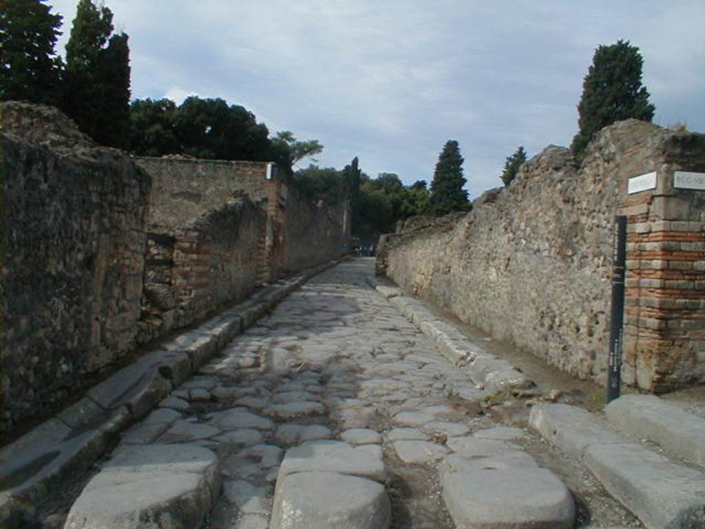 VIII.7 Pompeii. Via del Tempio dIside, looking west between temple and VIII.4.28, on corner. 



