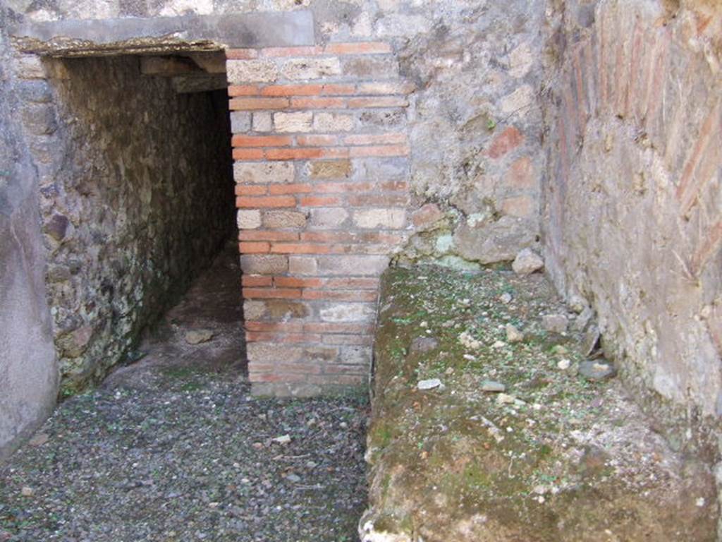 VIII.6.8 Pompeii. September 2005. Looking south to doorway leading to basement storerooms or cellars.