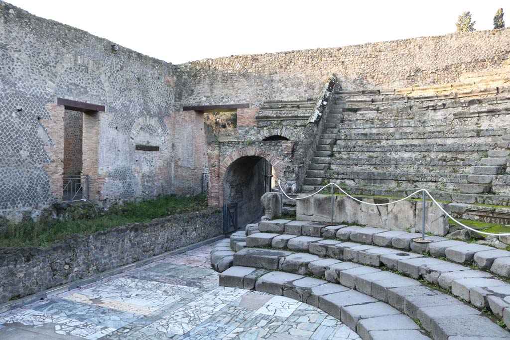 VIII.7.19 Pompeii. December 2018. 
Looking south-west towards west end of stage, doorway into corridor at VIII.7.17, and entrance/exit at west end of Theatre.
Photo courtesy of Aude Durand.
