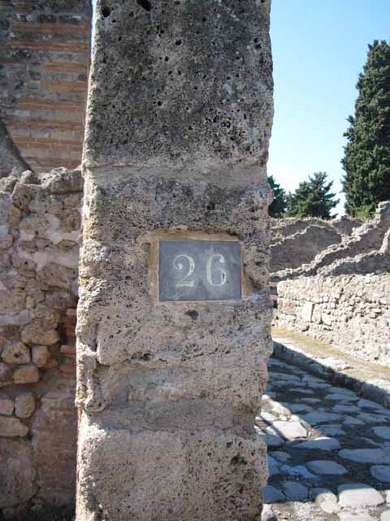 VIII.7.26 Pompeii. September 2010. ID Plate on west wall of entrance doorway. Photo courtesy of Drew Baker.
