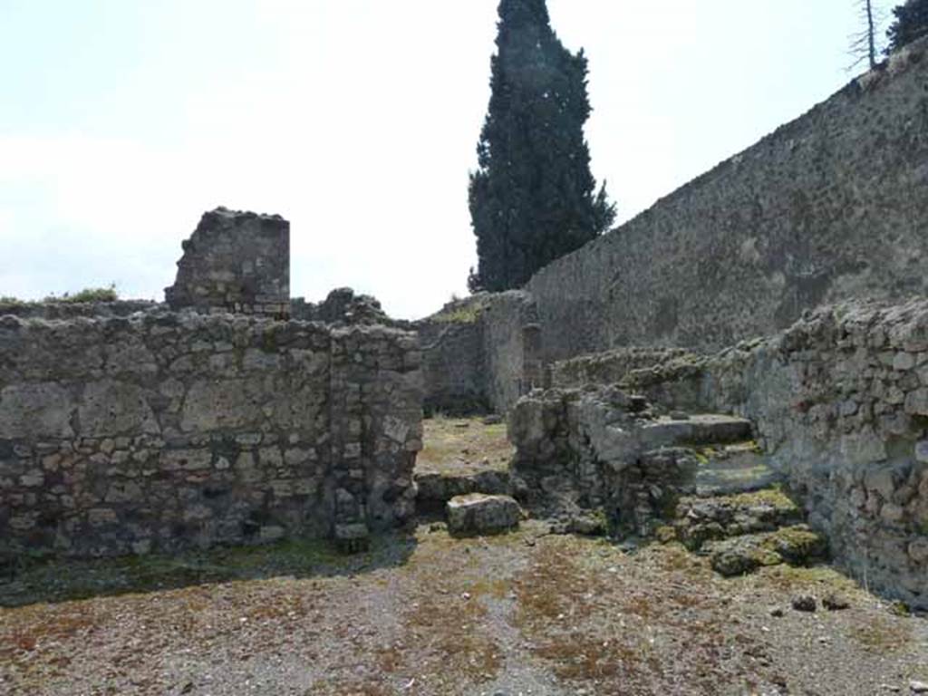 VIII.7.26 Pompeii. May 2010. Looking south across main entrance room, towards the corridor leading to the house at rear, and the steps to the upper floor.


