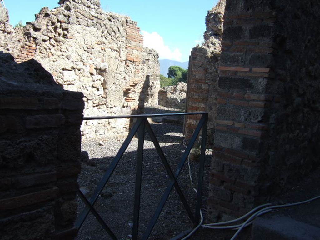 VIII.7.26 Pompeii. September 2005. Looking south to the atrium, from rear side entrance in alley on the west side.