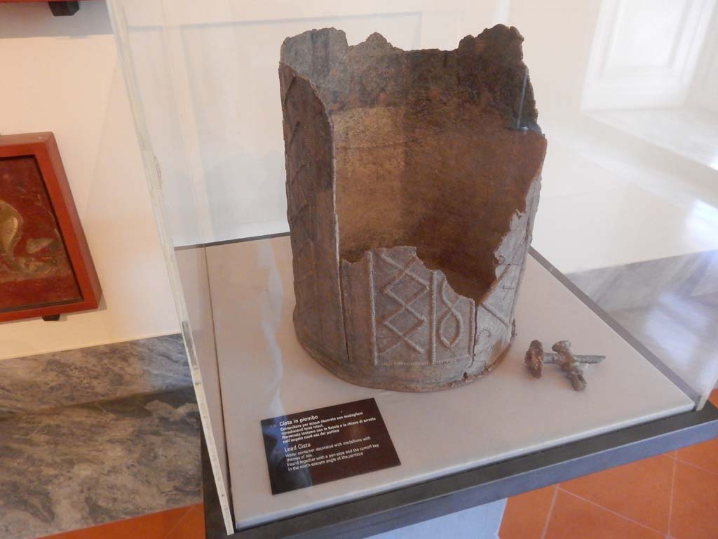 VIII.7.28 Pompeii. April 2019. Water container decorated with themes of Isis. 
Found in the north-east corner of the portico still connected to lead pipe with its stop key. 
Now in Naples Archaeological Museum. Inventory number 78594. Photo courtesy of Buzz Ferebee.

