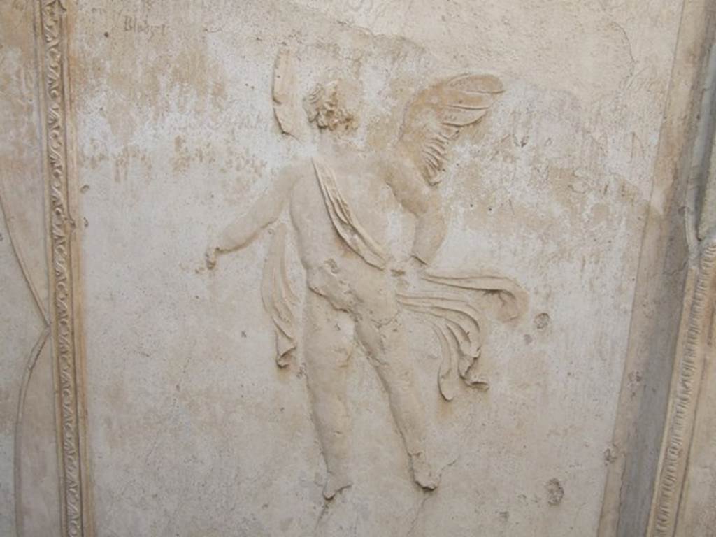 VIII.7.28 Pompeii. December 2007. Purgatorium, detail of stucco floating cupid from east side. See Mau, A., 1907, translated by Kelsey, F. W., Pompeii: Its Life and Art. New York: Macmillan. (p. 180).



