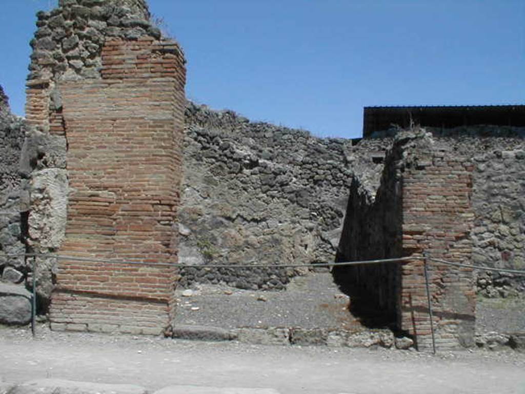 IX.1.9 Pompeii. May 2005. Entrance on Via Stabiana, looking east.
According to Della Corte, found on the pilaster between IX.1.9 or IX.1.10, on the right, was a painted recommendation, 
Faustinum aed(ilem)
Fabritius  rog(at)    [CIL IV 958 ]
He said he could not know which of the two shops this Pompeian was established in.
See Della Corte, M., 1965.  Case ed Abitanti di Pompei. Napoli: Fausto Fiorentino. (p.210) (see also IX.1.10) 
A bronze cooking pot without a handle, 36cm high, was found in this shop.
See Gallo, A (2001). Pompei, LInsula I della Regione IX, Settore Occidentale (p.61), in SAP book no. 1 (LErma di Bretschneider)
