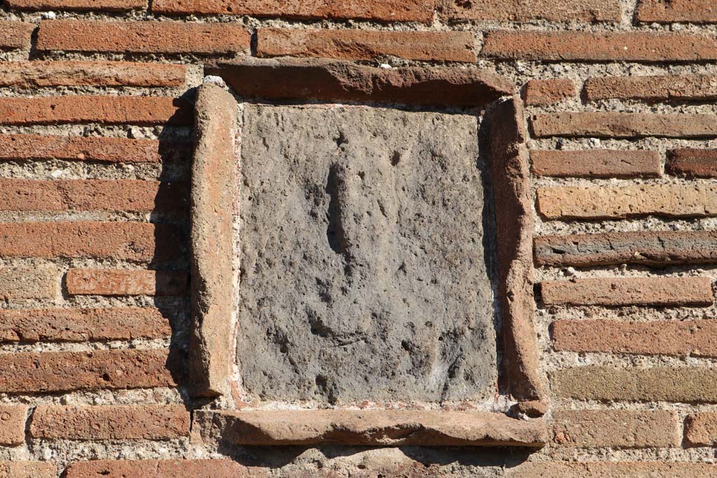 Plaque with phallus on pilaster between IX.2.6 and IX.2.7. March 2018. Looking east towards pilaster.
Foto Taylor Lauritsen, ERC Grant 681269 DCOR.

