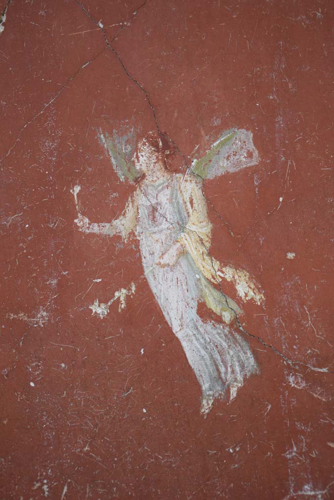 IX.12.6 Pompeii. February 2017. 
Room 3, painting of flying figure from north side of central painting on west wall.
Photo courtesy of Johannes Eber.
