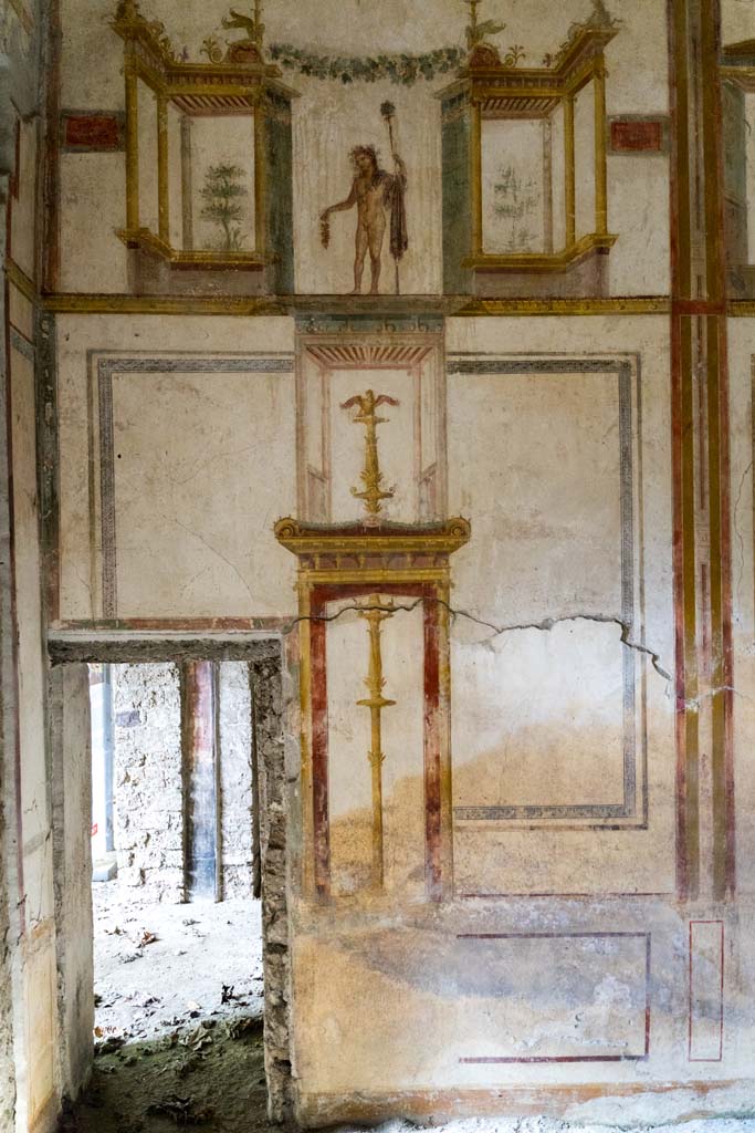 IX.13.1-3 Pompeii. October 2021. 
Room 11, detail of west wall in south-west corner, with doorway to room 12.
Photo courtesy of Johannes Eber.
