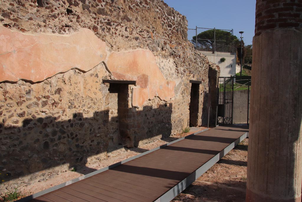 HGW24 Pompeii. Villa of Diomedes. October 2023. Doorways to rooms in north-east corner of peristyle.
On the left is a niche built into the north wall, on the right is the main entrance doorway. Photo courtesy of Klaus Heese.
