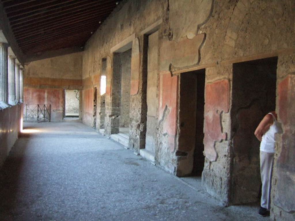 Villa of Mysteries, Pompeii. May 2006. Doorways to rooms 62, 7, 64, 19 and 20 on peristyle A. Looking south.