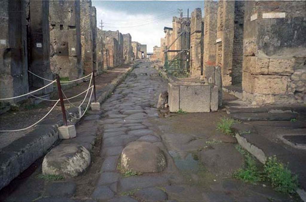 Via della Fortuna. July 2011. Looking west between VII.4 and VI.13. 
Photo courtesy of Rick Bauer.
