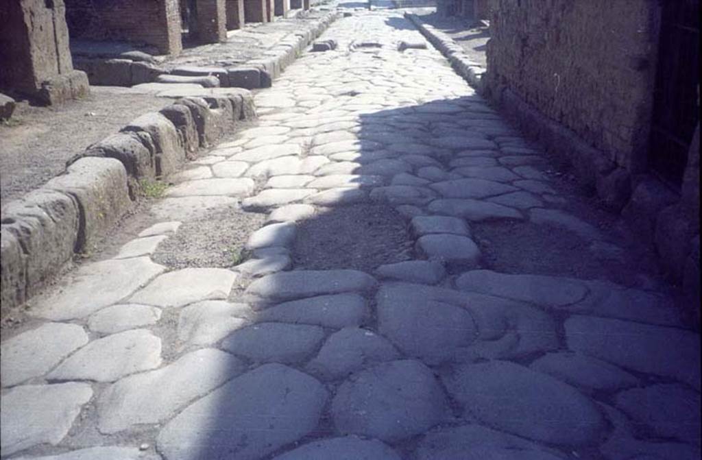 Via delle Terme. July 2011. Looking east between VI.6.4 and VII.5.8 at area of removed stepping stones. Photo courtesy of Rick Bauer.

