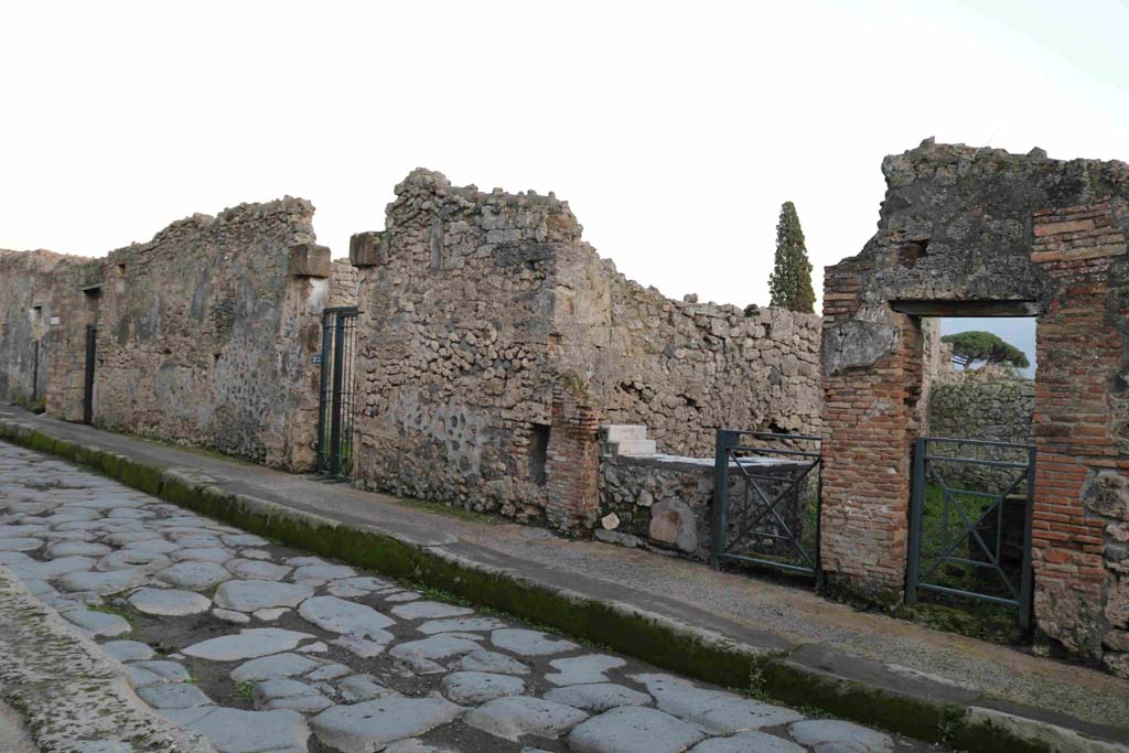 Vicolo del Menandro, (south side) Pompeii. December 2018. 
Looking east along 1.3, between doorways of I.3.24, 23, 22 and 21. Photo courtesy of Aude Durand.




