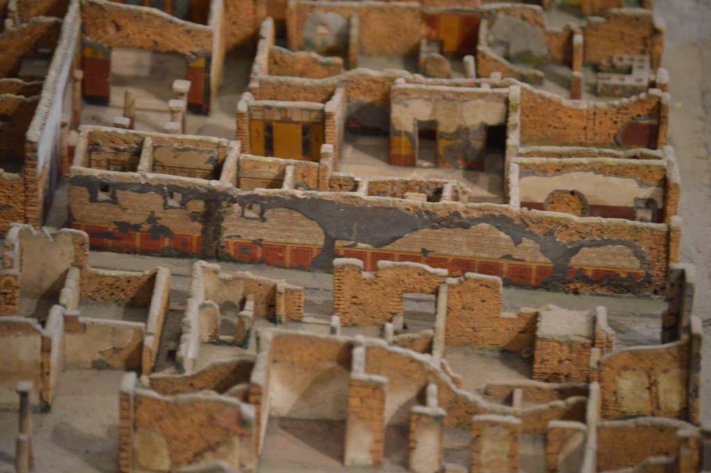 Vicolo della Fullonica between VI.6 and VI.8, in centre. Detail from model in Naples Archaeological Museum.
Looking towards detail of east wall of roadway, exterior wall of VI.8.3/5, the House of the Tragic Poet. 
Foto Taylor Lauritsen, ERC Grant 681269 DÉCOR.
