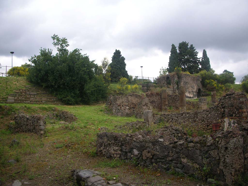 Tower XII, Pompeii, upper right. May 2010. 
Looking towards south side of city wall and tower, from doorway into VI.2.18 in Vicolo di Narciso.Photo courtesy of Ivo van der Graaff.
