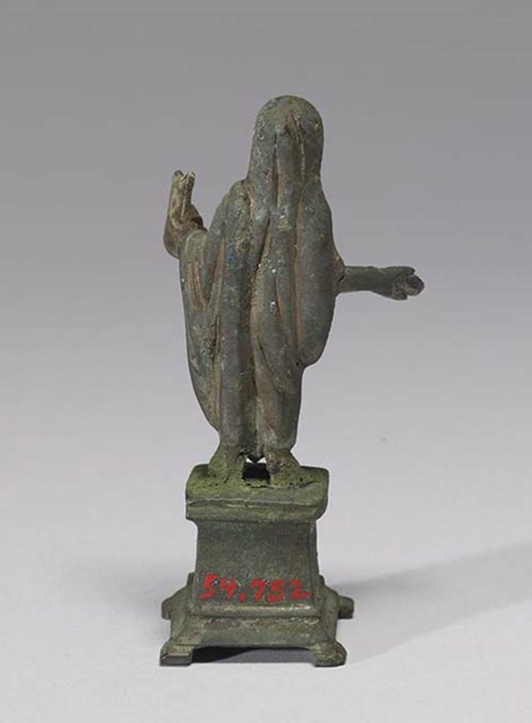 Boscoreale, Villa rustica in fondo DAcunzo. Room 12, lararium. 
Bronze statuette of sacrificing priest or genius familiaris, rear view.
Photo courtesy of The Walters Art Museum, Baltimore. Inventory number 54.752.
http://thewalters.org/
Creative Commons Attribution-ShareAlike 3.0 Unported Licence
