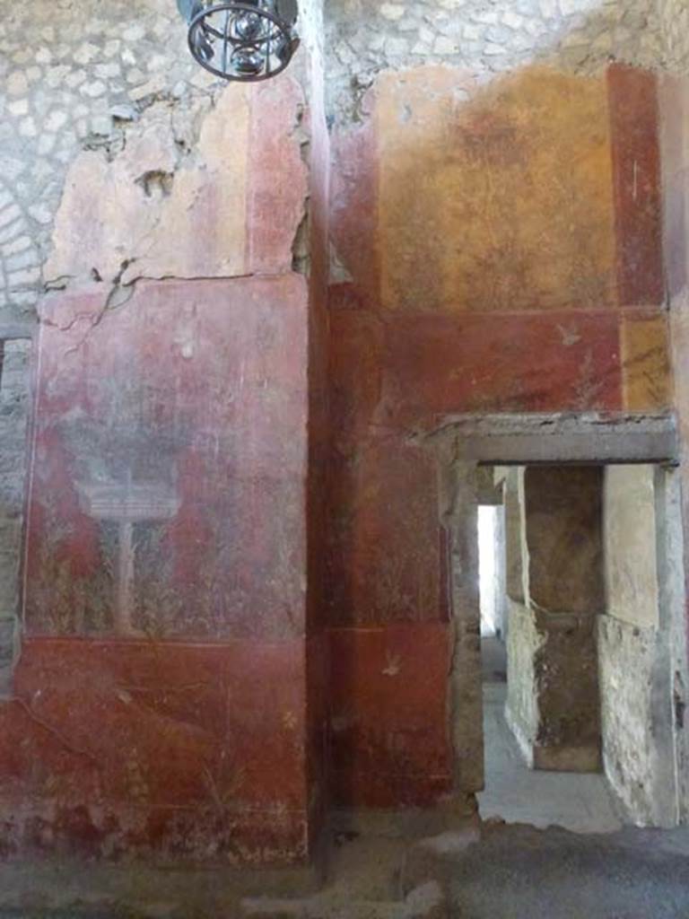 Oplontis, September 2011. Room 87, painted south wall, and doorway into room 73, at the rear of room 74.  Photo courtesy of Michael Binns.
