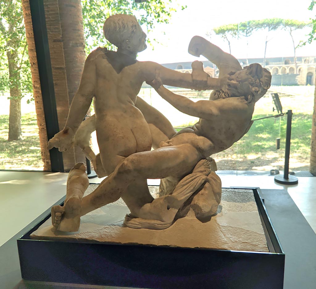 Oplontis Villa of Poppea, April 2022. 
Statuette of hermaphrodite and a faun, on display at II.7.9, the Palaestra in Pompeii.
Photo courtesy of Giuseppe Ciaramella.
