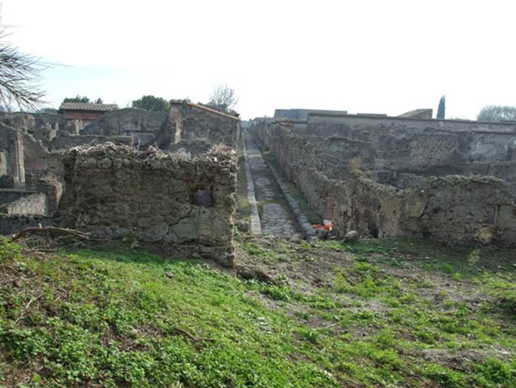 Looking south along Vicolo di Modesto from the city walls at Tower XII. December 2007.
VI.2.19 is on the right.
