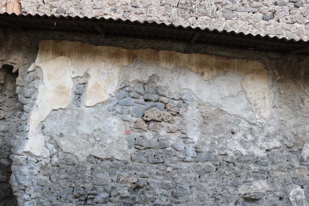 Pompeii Street Altar at I.8.1. December 2018. Remains of plaster and painting on south side of altar. Photo courtesy of Aude Durand.